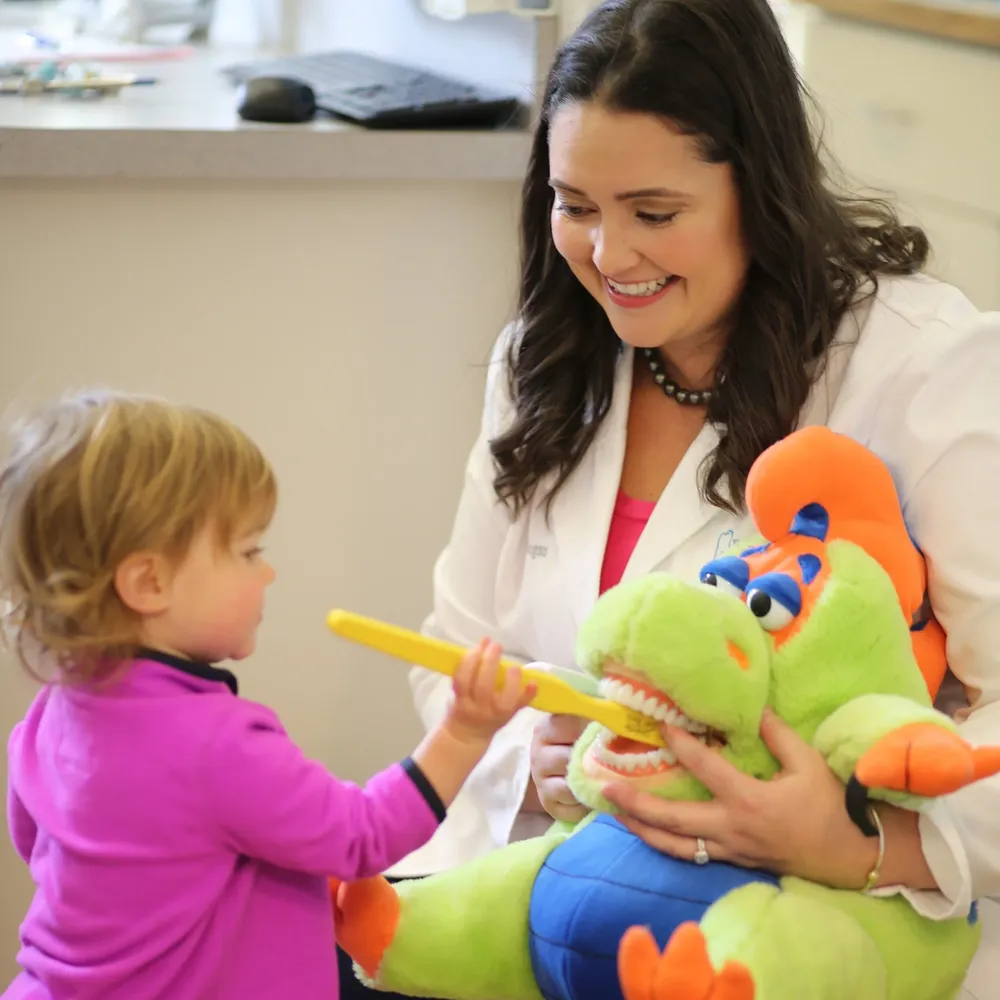 Dr. Regan with a young patient