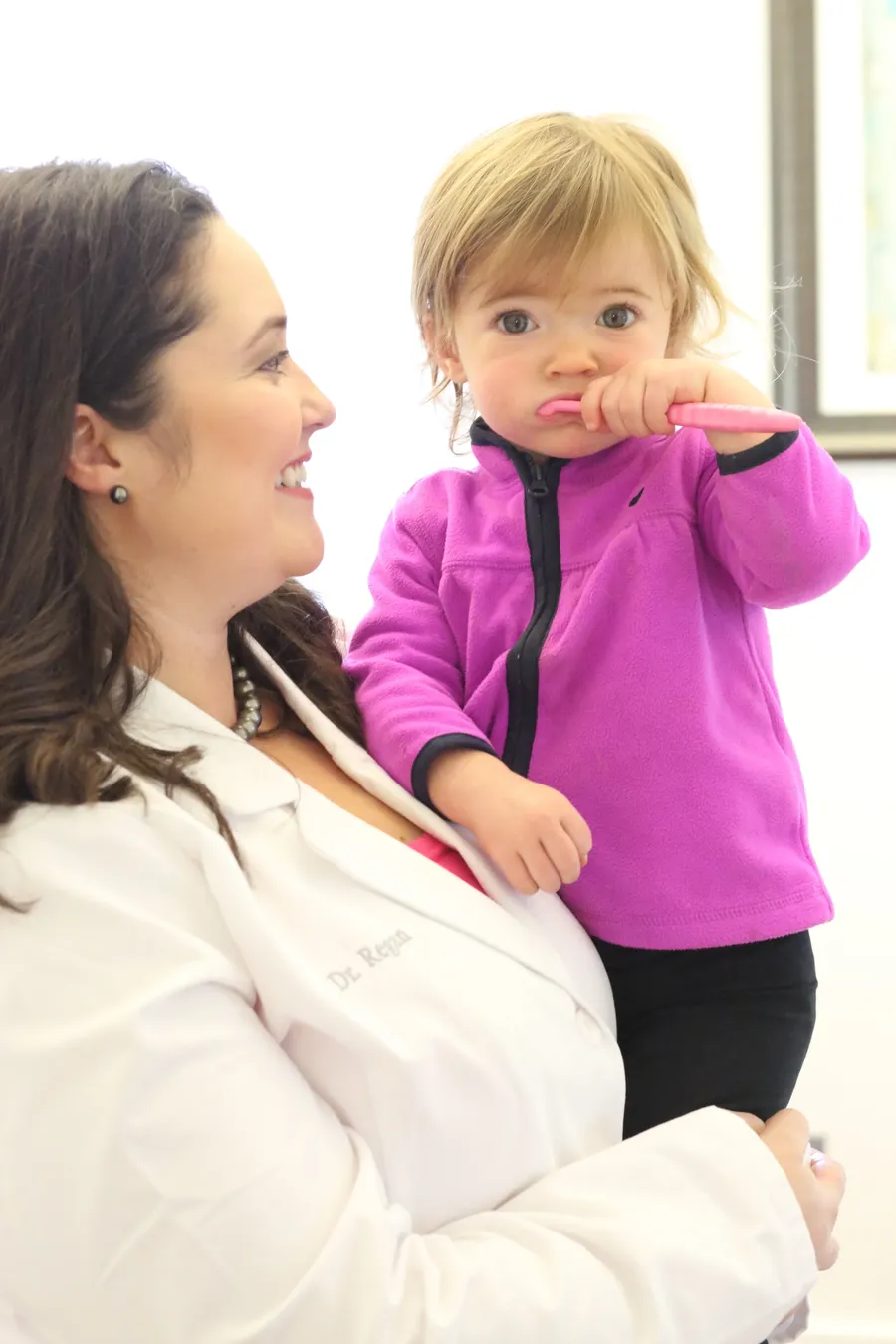 Dr. Regan with a toddler patient